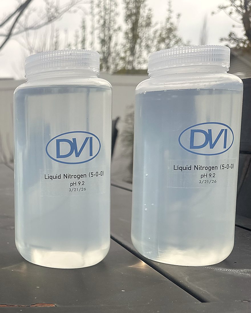 Two sample bottles of DVI liquid nitrogen, a clear water-like solution